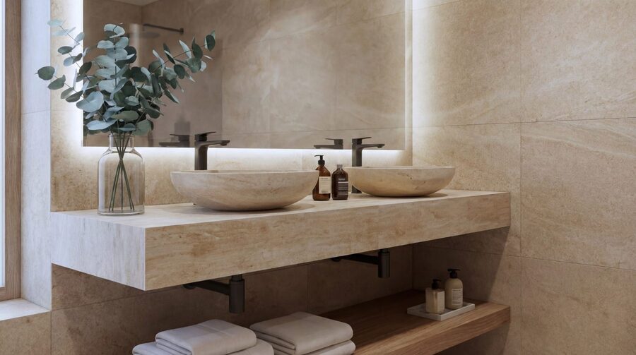 Primary bathroom with twin vessel basins and a stone vanity